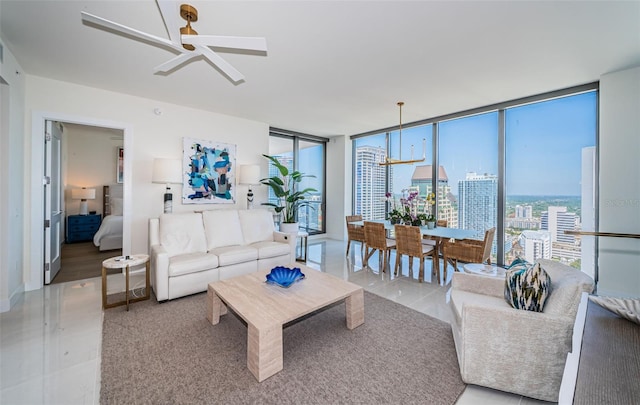 301 1st St S Unit 3004, Saint Petersburg, FL 33701 - living area featuring ceiling fan with notable chandelier, a city view, and expansive windows