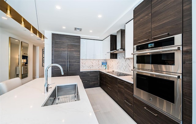 301 1st St S Unit 3004, Saint Petersburg, FL 33701 - kitchen featuring wall chimney exhaust hood, recessed lighting, modern cabinets, black electric stovetop, and double oven