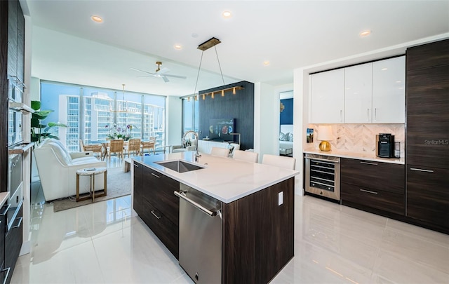 301 1st St S Unit 3004, Saint Petersburg, FL 33701 - kitchen featuring wine cooler, stainless steel dishwasher, modern cabinets, light tile patterned flooring, and a sink