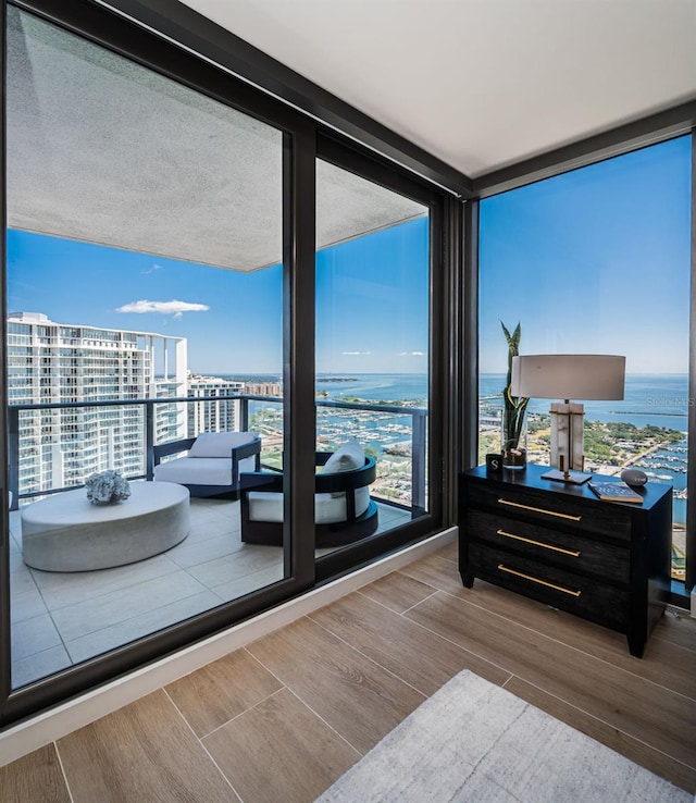 301 1st St S Unit 3004, Saint Petersburg, FL 33701 - interior space featuring floor to ceiling windows, wood finished floors, a water view, and a view of city