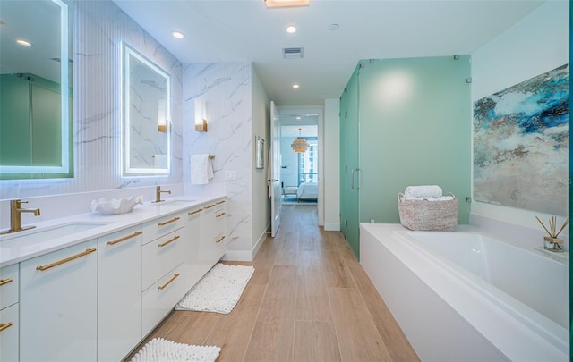 301 1st St S Unit 3004, Saint Petersburg, FL 33701 - full bathroom with double vanity, visible vents, ensuite bathroom, and a sink