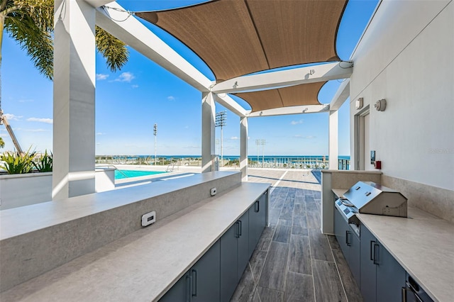 301 1st St S Unit 3004, Saint Petersburg, FL 33701 - view of patio with grilling area, an outdoor kitchen, and a water view