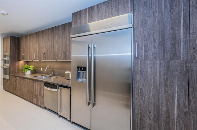 301 1st St S Unit 3004, Saint Petersburg, FL 33701 - kitchen featuring modern cabinets, light tile patterned floors, stainless steel appliances, and a sink