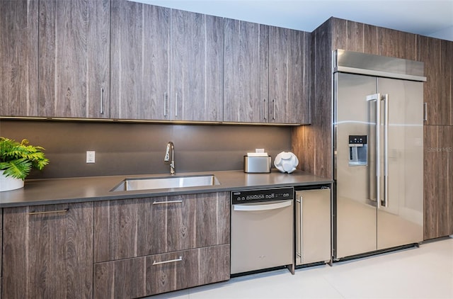 301 1st St S Unit 3004, Saint Petersburg, FL 33701 - kitchen featuring modern cabinets, dark brown cabinetry, stainless steel appliances, and a sink