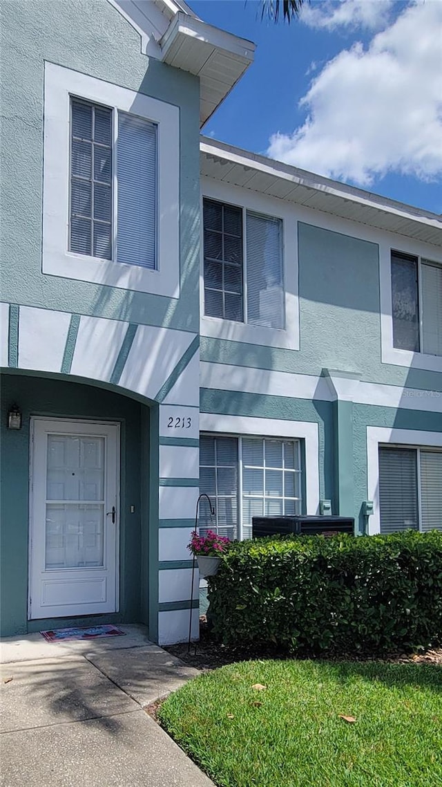 2213 Fluorshire Dr, Brandon, FL 33511 - doorway to property featuring stucco siding