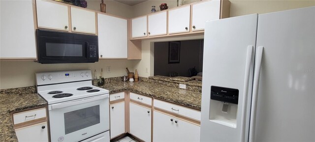 2213 Fluorshire Dr, Brandon, FL 33511 - kitchen featuring white appliances, white cabinets, and dark stone counters