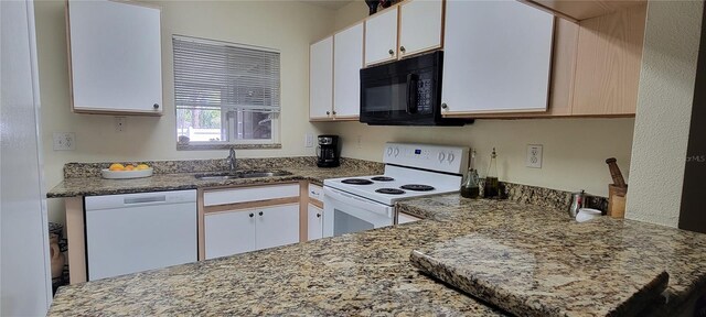 2213 Fluorshire Dr, Brandon, FL 33511 - kitchen with white appliances, a sink, white cabinetry, and light stone counters