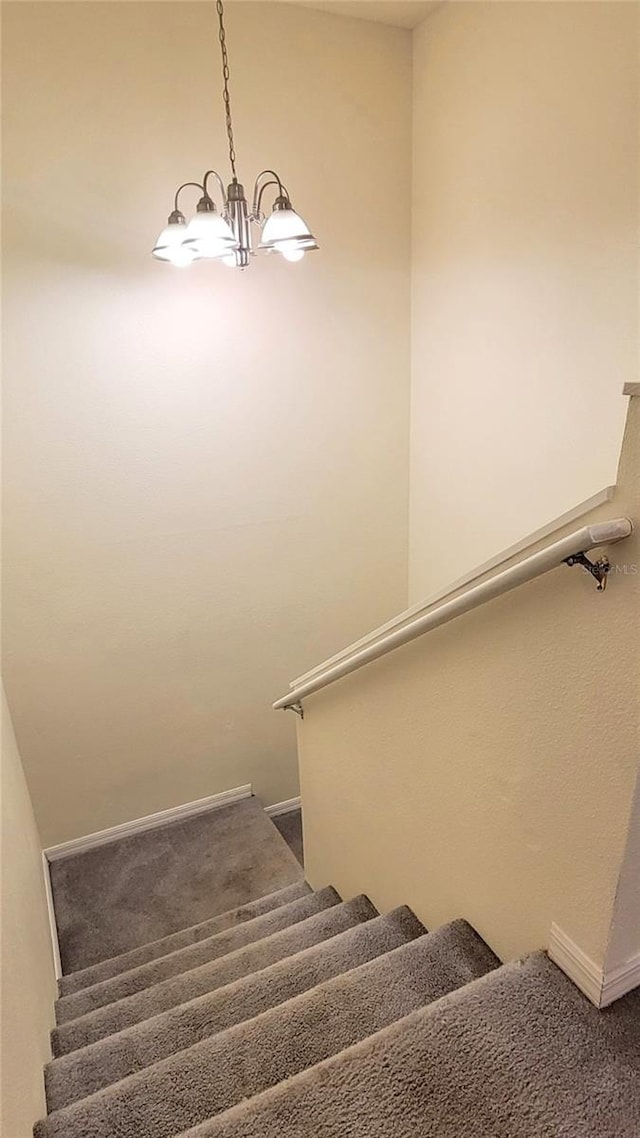 2213 Fluorshire Dr, Brandon, FL 33511 - staircase with a chandelier, baseboards, and carpet floors