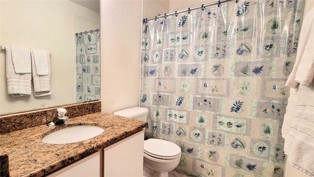 2213 Fluorshire Dr, Brandon, FL 33511 - bathroom with toilet, vanity, and a shower with curtain