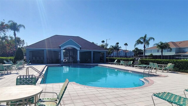 2213 Fluorshire Dr, Brandon, FL 33511 - community pool with a patio and fence