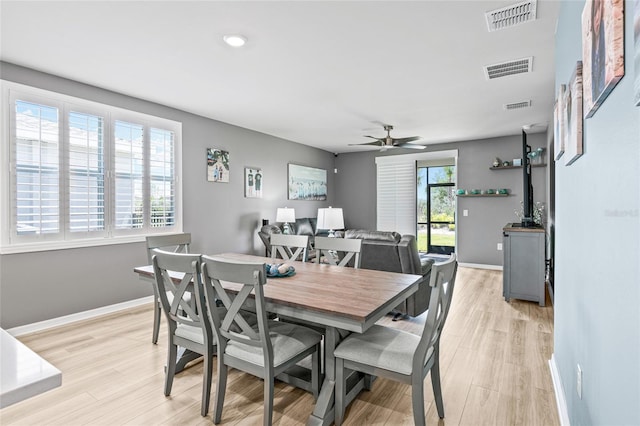 44239 Frontier Dr, Punta Gorda, FL 33982 - dining room featuring visible vents, light wood-type flooring, and ceiling fan