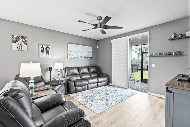 44239 Frontier Dr, Punta Gorda, FL 33982 - living area with light wood-type flooring, a ceiling fan, and baseboards