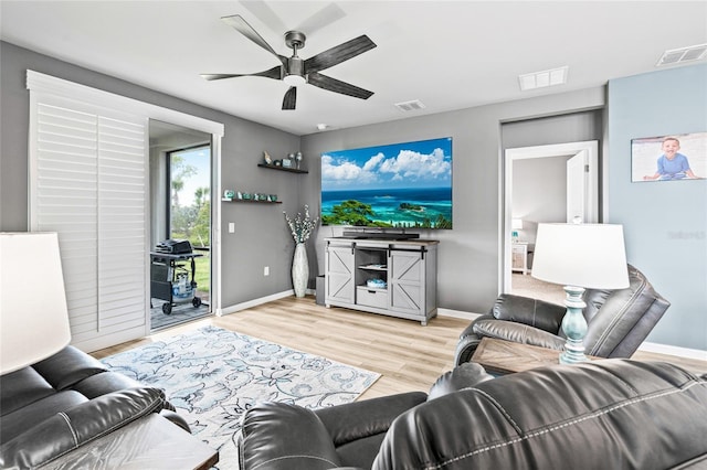 44239 Frontier Dr, Punta Gorda, FL 33982 - living area with visible vents, ceiling fan, wood finished floors, and baseboards