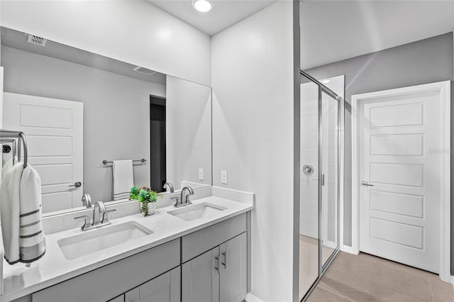 44239 Frontier Dr, Punta Gorda, FL 33982 - bathroom featuring a sink, visible vents, a shower stall, and double vanity