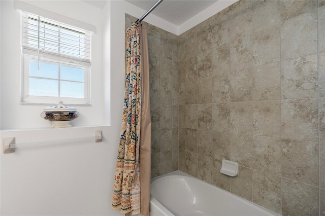 bathroom featuring shower / bath combo with shower curtain