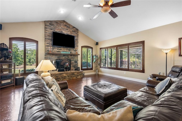 living area with high vaulted ceiling, a ceiling fan, wood finished floors, a fireplace, and baseboards