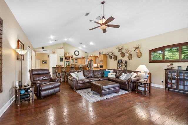 living area with vaulted ceiling, visible vents, hardwood / wood-style flooring, and ceiling fan