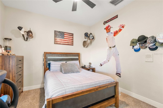 carpeted bedroom featuring baseboards, visible vents, and ceiling fan