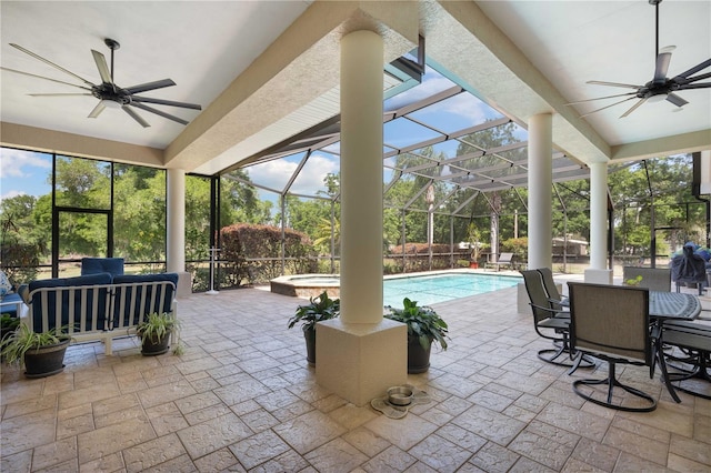 outdoor pool with outdoor lounge area, a patio area, ceiling fan, and an in ground hot tub