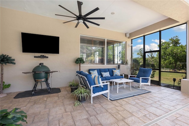 exterior space featuring ceiling fan and an outdoor living space