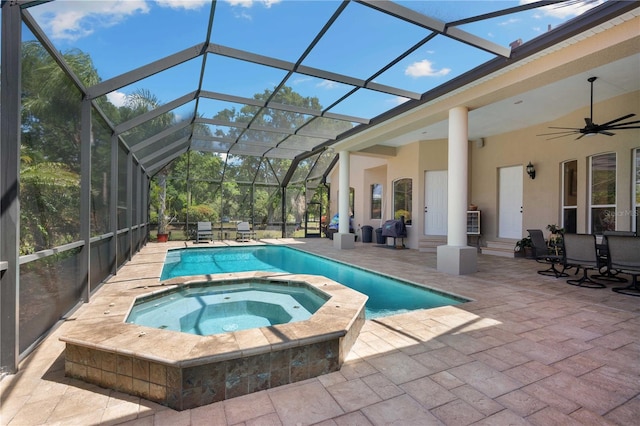 view of pool featuring a patio area, a ceiling fan, and a pool with connected hot tub