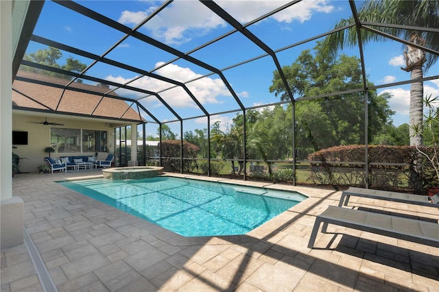 view of pool with ceiling fan, a lanai, a patio area, and a pool with connected hot tub