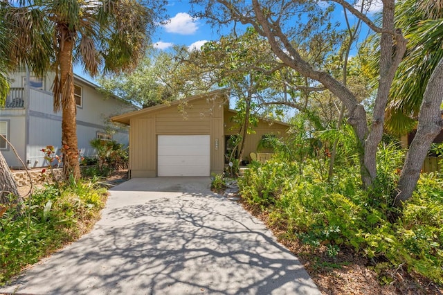 407 Indiana Ave, Crystal Beach, FL 34681 - exterior space featuring an attached garage and driveway