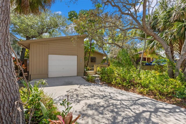 407 Indiana Ave, Crystal Beach, FL 34681 - garage featuring driveway