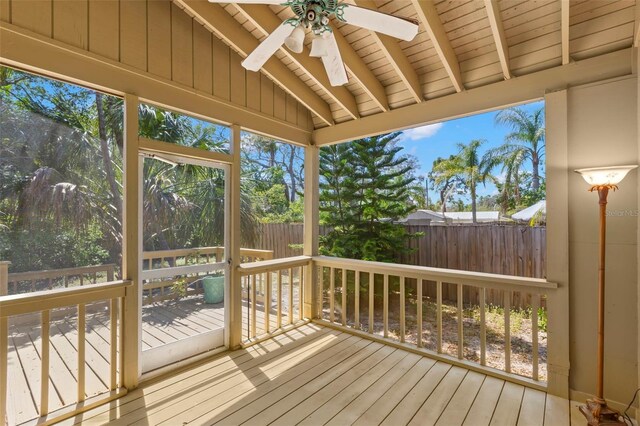 407 Indiana Ave, Crystal Beach, FL 34681 - unfurnished sunroom featuring beamed ceiling and a ceiling fan