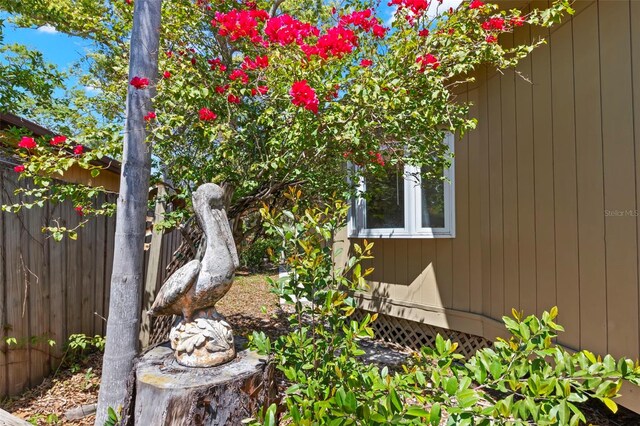 407 Indiana Ave, Crystal Beach, FL 34681 - view of side of property with fence