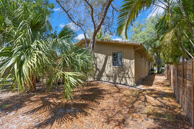 407 Indiana Ave, Crystal Beach, FL 34681 - view of side of home with fence