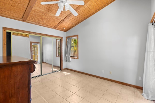 407 Indiana Ave, Crystal Beach, FL 34681 - unfurnished bedroom featuring baseboards, wooden ceiling, light tile patterned flooring, and lofted ceiling with beams