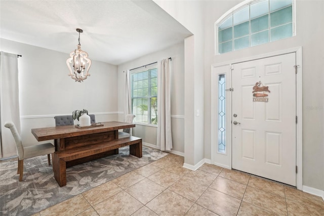 7207 Forest Mere Dr, Riverview, FL 33578 - entryway with a chandelier, light tile patterned flooring, and baseboards