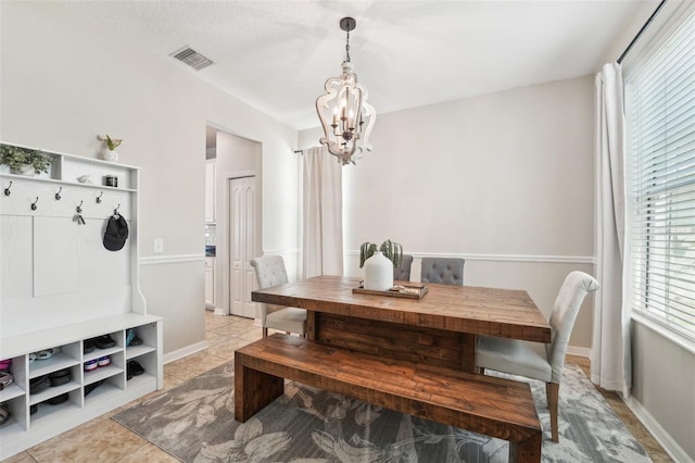 7207 Forest Mere Dr, Riverview, FL 33578 - dining area featuring a chandelier, light tile patterned floors, and baseboards