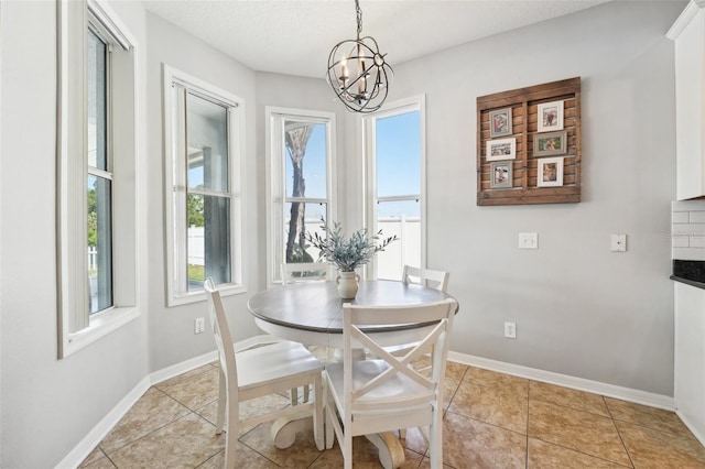 7207 Forest Mere Dr, Riverview, FL 33578 - dining area featuring a chandelier, baseboards, and light tile patterned flooring