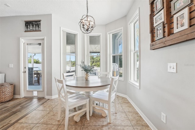 7207 Forest Mere Dr, Riverview, FL 33578 - dining room featuring a chandelier, baseboards, and light tile patterned flooring