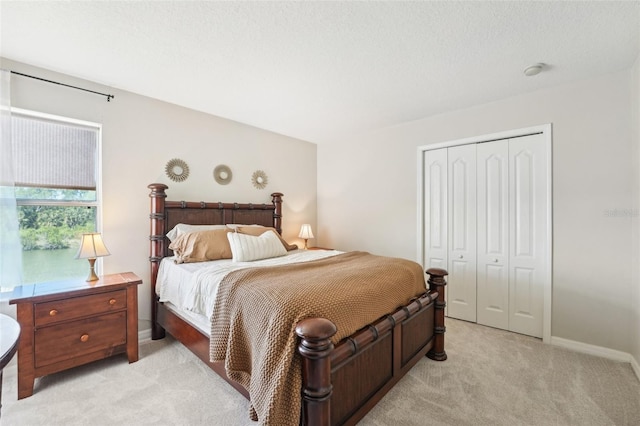 7207 Forest Mere Dr, Riverview, FL 33578 - bedroom featuring light carpet, a closet, and baseboards