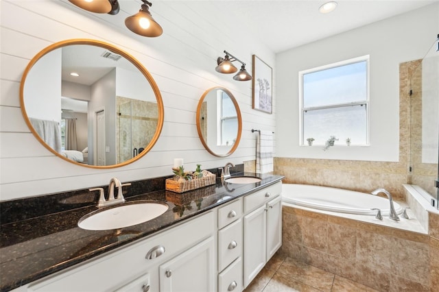7207 Forest Mere Dr, Riverview, FL 33578 - bathroom featuring double vanity, a bath, tile patterned floors, and tiled shower