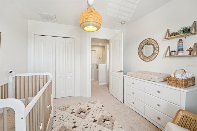 7207 Forest Mere Dr, Riverview, FL 33578 - bedroom with light carpet, a closet, a nursery area, and baseboards