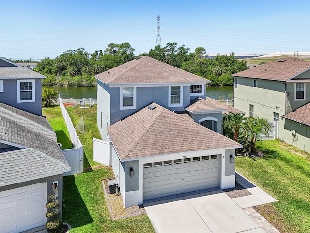 7207 Forest Mere Dr, Riverview, FL 33578 - view of front of home featuring roof with shingles, stucco siding, and a water view
