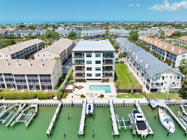 birds eye view of property with a water view