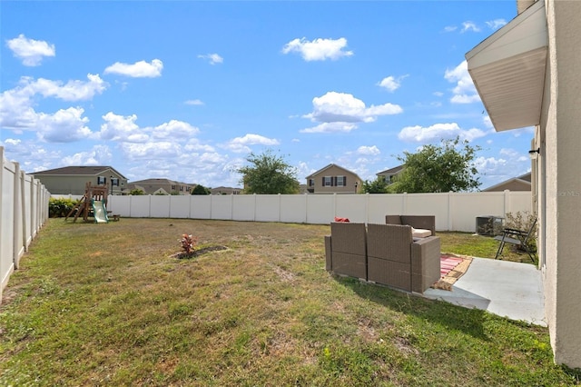 10101 Mangrove Well Rd, Ruskin, FL 33573 - view of yard featuring a patio area, a fenced backyard, outdoor lounge area, and a playground