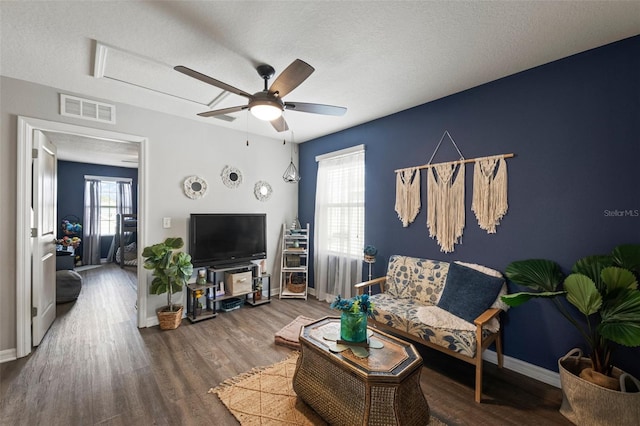 10101 Mangrove Well Rd, Ruskin, FL 33573 - living room with wood finished floors, baseboards, a ceiling fan, and visible vents