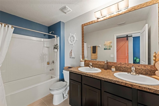 10101 Mangrove Well Rd, Ruskin, FL 33573 - bathroom with tile patterned floors, a textured ceiling, a sink, and toilet