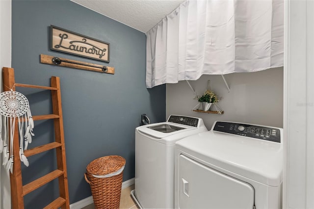 10101 Mangrove Well Rd, Ruskin, FL 33573 - washroom with laundry area, washing machine and clothes dryer, baseboards, and a textured ceiling