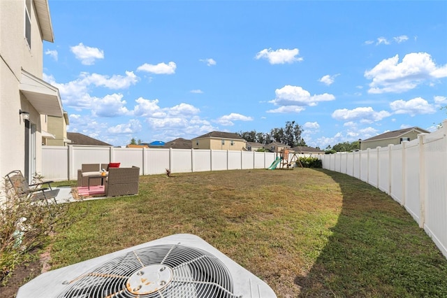 10101 Mangrove Well Rd, Ruskin, FL 33573 - view of yard featuring a fenced backyard, cooling unit, and a playground