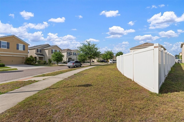 10101 Mangrove Well Rd, Ruskin, FL 33573 - view of yard featuring fence and a residential view