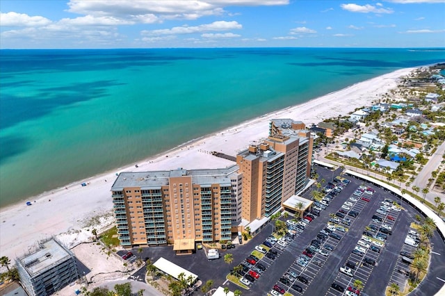 bird's eye view with a water view and a view of the beach
