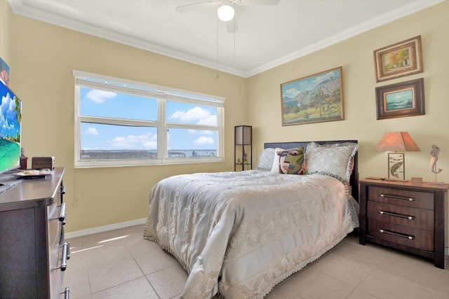 bedroom with crown molding, light tile patterned floors, baseboards, and a ceiling fan
