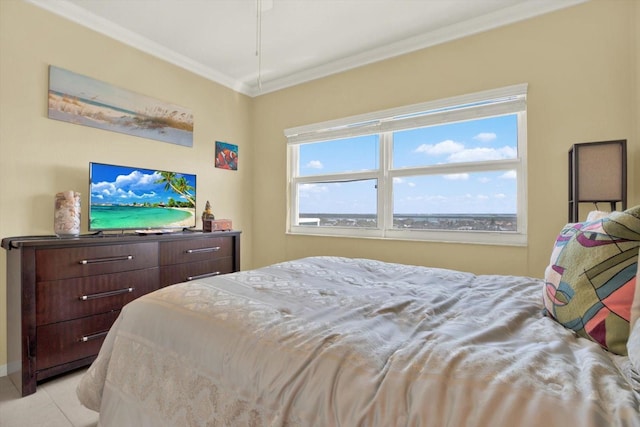 bedroom with light tile patterned floors and ornamental molding